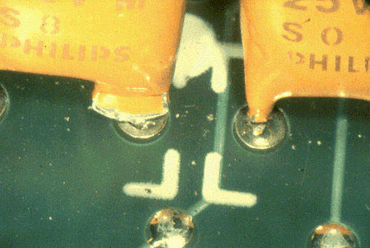 Figure 4: One hole has filled; the other has not